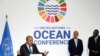 FILE - United Nations Secretary-General Antonio Guterres, left, gestures during a news conference with Portuguese President Marcelo Rebelo de Sousa and Kenya President Uhuru Kenyatta, right, at the U.N. Ocean Conference in Lisbon, June 27, 2022.