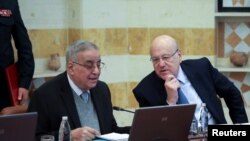 FILE - Lebanese Prime Minister Najib Mikati chats with Lebanese Foreign Minister Abdallah Bou Habib during a Cabinet meeting at the presidential palace in Baabda, Lebanon, Jan. 24, 2022. 