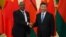 FILE - Malawi's then-President Arthur Peter Mutharika shakes hands with China's President Xi Jinping in Beijing, Sept. 1, 2018. China is working to protect its image in Africa after racist videos of African children made by a Chinese man living in Malawi surfaced this week.