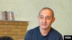 Independent journalist Natig Javadli is pictured during a VOA interview, Dec. 15, 2021. He says journalists and human rights activists have been pressured in Azerbaijan for years.
