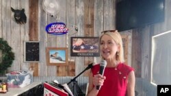 Republican incumbent Rep. Mary Miller speaks to voters during a campaign stop for Illinois gubernatorial candidate Darren Bailey in Athens, Ill., June 14, 2022.