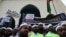 Activists and supporters hold placards as they gather outside the Baitul Mukarram National mosque before marching toward the Indian Embassy in Dhaka on June 16, 2022, to protest remarks about the Prophet Muhammad by Indian ruling party members.