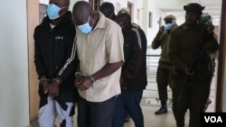 Albino attackers leave court after they are sentenced on June 27 , 2022. (Lameck Masina/VOA)