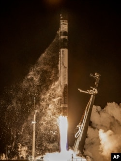 Rocket Lab's Electron rocket is successfully launched on the Mahia peninsula in New Zealand, Tuesday, June 28, 2022. (Rocket Lab via AP)