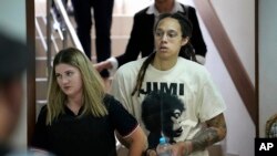 WNBA star and two-time Olympic gold medalist Brittney Griner is escorted to a courtroom for a hearing in Khimki just outside Moscow, Russia, July 1, 2022. 
