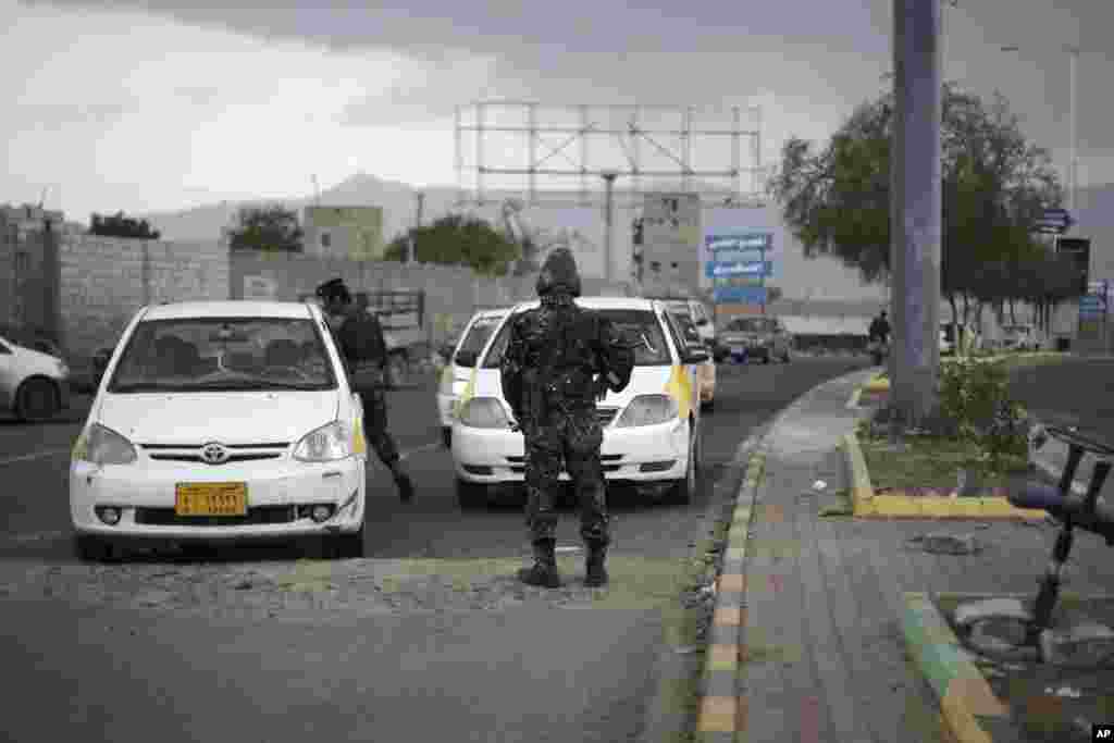 Pro-Russian rebels sit in their car with a heavy machine gun in Donetsk, eastern Ukraine, Sept. 7, 2014. 