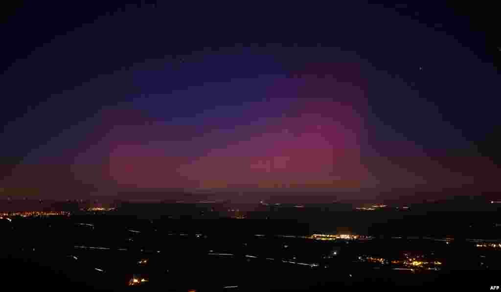 This picture taken from the southeastern France village of La Roquebrussanne shows an aurora borealis early on Jan. 1, 2025. 