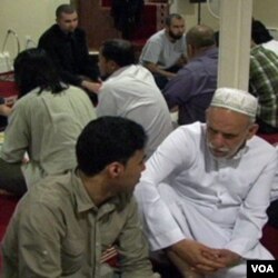 A student conversing with an elderly at Golden Islamic Center, Colorado.