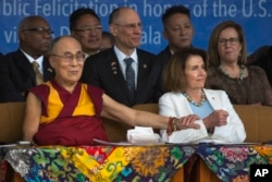 Tibetan spiritual leader Dalai Lama holds the arm of U.S. House Minority Leader Nancy Pelosi at the Tsuglagkhang temple in Dharmsala, India, May 10, 2017.