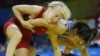 Clarissa Chun of the U.S., in blue, wrestles Sweden's Sofia Mattsson in their women's freestyle 48 kilogram match at the Beijing 2008 Olympics in Beijing, China, Aug. 16, 2008. 