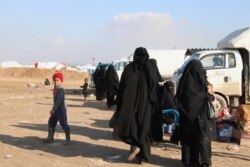FILE - Wives and children of IS fighters are detained in al-Hol camp in Syria, Feb. 18, 2020. (Heather Murdock/VOA)
