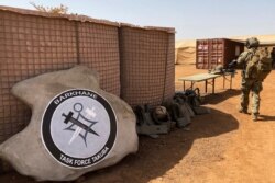 FILE - The France-led special operations logo for the new Barkhane Task Force Takuba, a multinational military mission in sub-Saharan Africa’s troubled Sahel region, is seen Nov. 3, 2020.