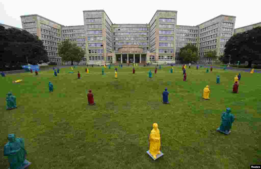 Johann Wolfgang von Goethe plastic statues, designed by Ottmar Hoerl stand in front of the Goethe University in Frankfurt, Germany.
