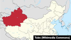 A map of China shows Xinjiang Uyghur Autonomous Region in red. 