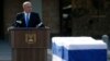 Israel's Prime Minister Benjamin Netanyahu speaks near the flag draped coffin of former Israeli Prime Minister Ariel Sharon during a memorial ceremony for Sharon at the Knesset, Israel's parliament, in Jerusalem, Jan. 13, 2014. 