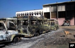 Burnt vehicles by protesters are seen piled up in Rohtak, in Haryana state, India, Feb. 21, 2016.