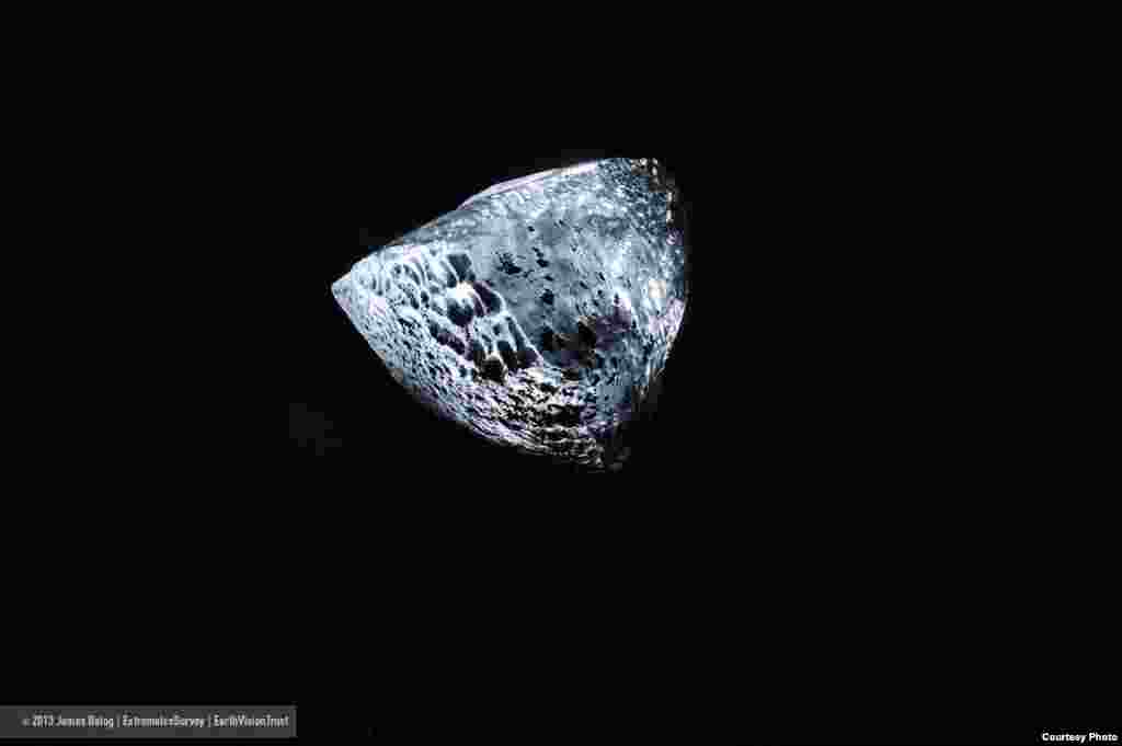 Icebergs from Jökulsárlón, Iceland, break into small chucks like these so-called ice diamonds, which contribute, drop by drop, to the rise of global sea level. (James Balog/Extreme Ice Survey)