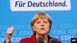 German Chancellor and CDU top candidate Angela Merkel speaks during an election campaign meeting in Giessen, Germany, Sept.4, 2013.