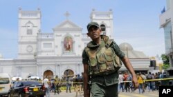 Sri Lankan Army soldiers secure the area around St. Anthony's Shrine after a blast in Colombo, Sri Lanka, Sunday, April 21, 2019. 