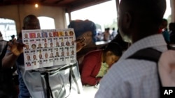 FILE - Electoral workers count ballots at a polling station in Port-au-Prince, Haiti, Nov. 20, 2016. 