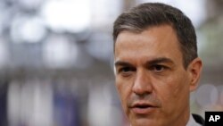 Spain's Prime Minister Pedro Sanchez speaks with the media as he arrives for an EU summit at the European Council building in Brussels, May 24, 2021. 