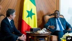 U.S. Secretary of State Antony Blinken, left, meets with Senegalese President Macky Sall at the Presidential Palace in Dakar, Senegal, Nov. 20, 2021.