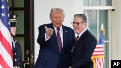 Britain's Prime Minister Keir Starmer is greeted by President Donald Trump as he arrives at the White House in Washington, Feb. 27, 2025. 