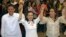 Newy proclaimed Philippine senators, from left: Sen. Francis Joseph Escudero, Sen. Grace Poe and Sen. Loren Legarda raise hands at the National Board Canvassing Center in suburban Pasay, south of Manila, May 16, 2013. 
