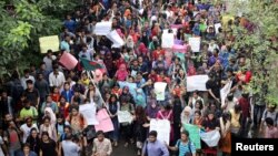 Thousands of students join in a protest over recent traffic accidents that killed a boy and a girl, in Dhaka, Bangladesh, Aug. 5, 2018. 