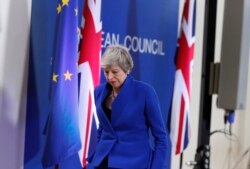FILE - British Prime Minister Theresa May leaves the podium after addressing a media conference at the conclusion of an EU summit in Brussels, April 11, 2019. (AP)