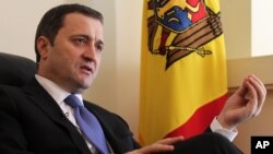 FILE - Moldova's Prime Minister Vlad Filat speaks during an interview with The Associated Press at the Moldovan embassy in Brussels, Belgium, March 27, 2012.