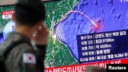 A South Korean soldier walks past a TV broadcasting a news report on North Korea firing a missile that is believed to be launched from a submarine, in Seoul, South Korea, October 2, 2019. (REUTERS/Kim Hong-Ji)