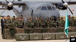 FILE - Lebanese army soldiers stand in front of French weapons at the Rafik Hariri International Airport in Beirut, Lebanon, April 20, 2015. The weapons were paid for by Saudi Arabia.