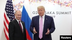 AQSh Prezidenti Donald Tramp (o'ngda) Rossiya rahbari Vladimir Putin bilan, Osaka, Yaponiya, 2019-yil, 28-iyun.