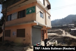 The earthquake-worn Tribeni community library stands on the hillside of the village of Bhimdhunga, Nepal, Feb.9, 2018.