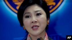 អតីត​នាយករដ្ឋមន្ត្រី ​Yingluck Shinawatra ថ្លែង​ទៅ​កាន់​អ្នក​យក​ព័ត៌មាន​កាល​ពី​ថ្ងៃ​ទី​៧ ខែ​ឧសភា ឆ្នាំ​២០១៤។