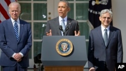 From left, Vice President Joe Biden listens as President Barack Obama announces the nomination of federal appeals court judge Merrick Garland for the Supreme Court, in the White House Rose Garden, Washington, March 16, 2016.