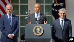 From left, Vice President Joe Biden listens as President Barack Obama announces the nomination of federal appeals court judge Merrick Garland for the Supreme Court, in the White House Rose Garden, Washington, March 16, 2016. 