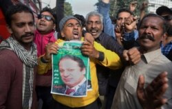 FILE - Supporters of former Pakistani Prime Minister Nawaz Sharif chant slogans outside the Lahore High court, in Lahore, Pakistan, Nov. 16, 2019.