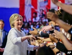 Democratic presidential candidate Hillary Clinton greets supporters during a rally on June 7, 2016.