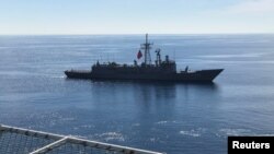 FILE - Turkish Navy frigate Gaziantep escorts drilling vessel Fatih off the Mediterranean resort city of Antalya, Turkey, Oct. 30, 2018.
