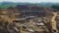FILE - Excavators and drillers at work in an open pit at Tenke Fungurume, a copper and cobalt mine 110 km (68 miles) northwest of Lubumbashi in Congo's copper-producing south, Jan. 29, 2013. 