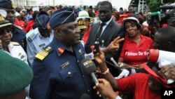 Nigeria's Chief of Defense Staff Air Marshal Alex Badeh, speaks during a demonstration calling on the government to rescue the kidnapped girls, Abuja, Nigeria, May 26, 2014.