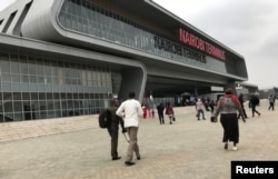FILE - Passengers arrive to purchase tickets for the Standard Gauge Railway (SGR) line constructed by the China Road and Bridge Corporation (CRBC) and financed by the Chinese government at the Nairobi Terminus in the outskirts Nairobi, Kenya, July 28, 2017.