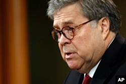 FILE - Attorney General William Barr speaks about the release of a redacted version of special counsel Robert Mueller's report during a news conference, April 18, 2019, at the Department of Justice in Washington.