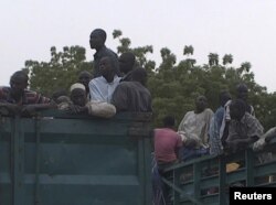 Former Nigerian hostages held by Boko Haram who were freed by the Cameroonian military arrive in Maroua, Cameroon, in this still image taken from a Dec. 5, 2015 video footage.