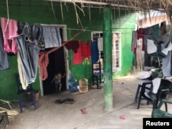 A child walks out of a house in an area where Mexico's next President Andres Manuel Lopez Obrador headed the Tabasco office of the National Indigenous Institute for several years, in Nacajuca, Mexico, June 30, 2018.