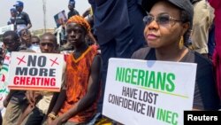 Supporters of the Peoples Democratic Party protest at the national headquarters of the Independent National Electoral Commission to question the outcome of the February 25 election result in Abuja, Nigeria, March 6, 2023. 