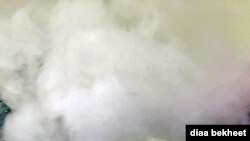 FILE- A man vapes with an electronic cigarette, exhales in Fair Oaks, Virginia. (Phot: Diaa Bekheet). The Centers for Disease Control and Prevention said on Oct. 24, 2019, that 125 additional cases of vaping related illnesses have been reported last week.