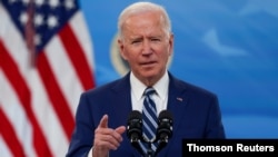 FILE PHOTO: U.S. President Biden delivers remarks after a meeting with his COVID-19 Response Team at the White House campus in Washington